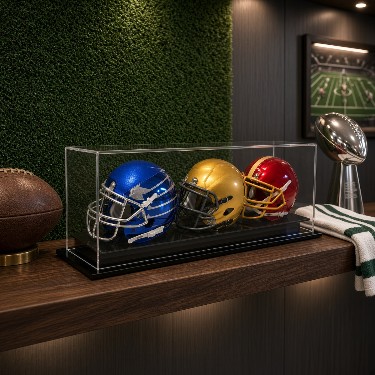 Triple mini helmet case on a counter in front of a green wall