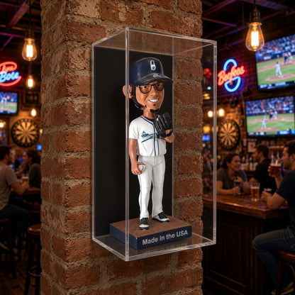 Bobblehead case mounted on a brick column in a sports bar