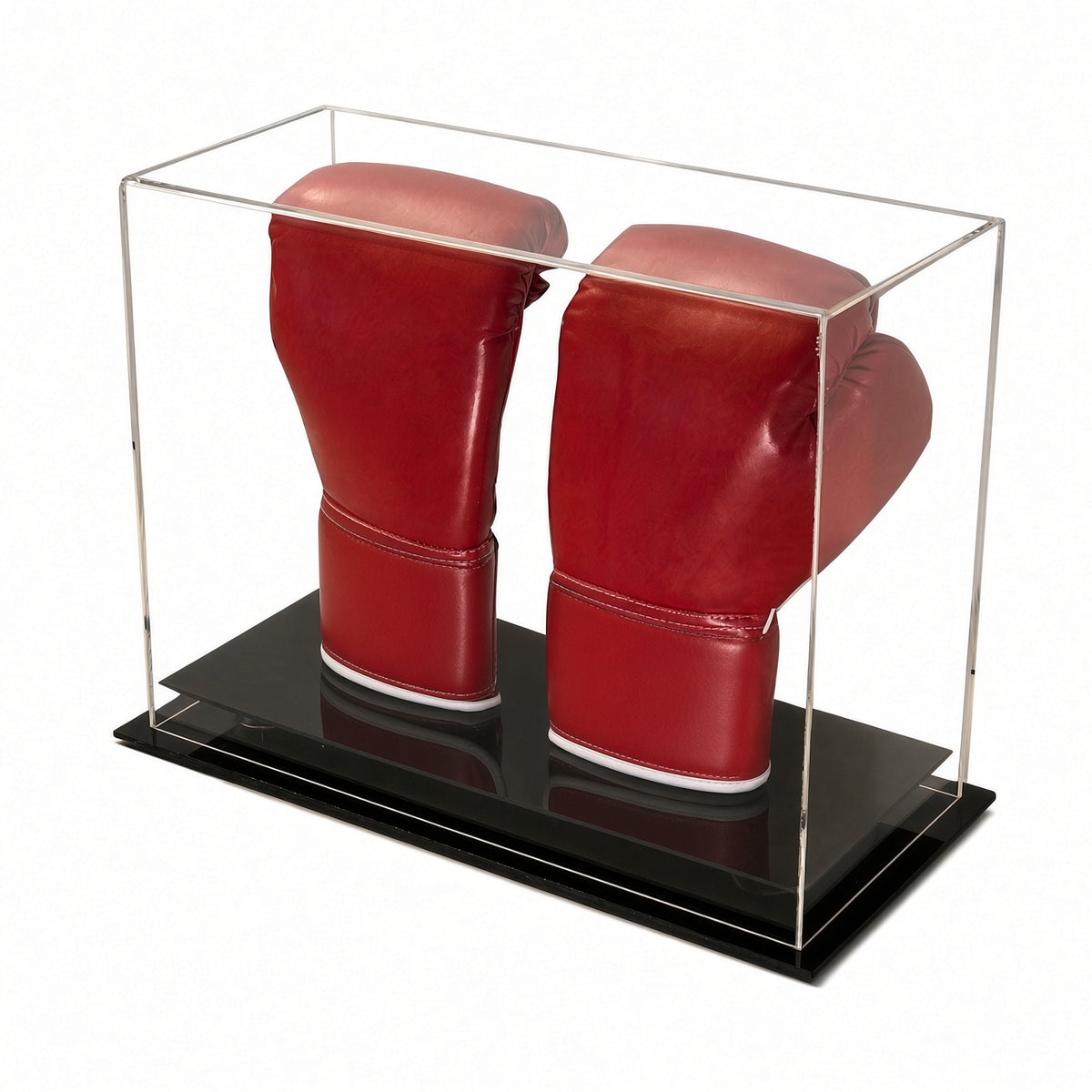Table top acrylic case with a black base holding a pair of red boxing gloves upright