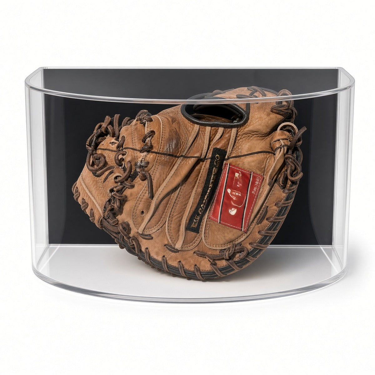 Front view of a catcher's mitt inside the curved acrylic case