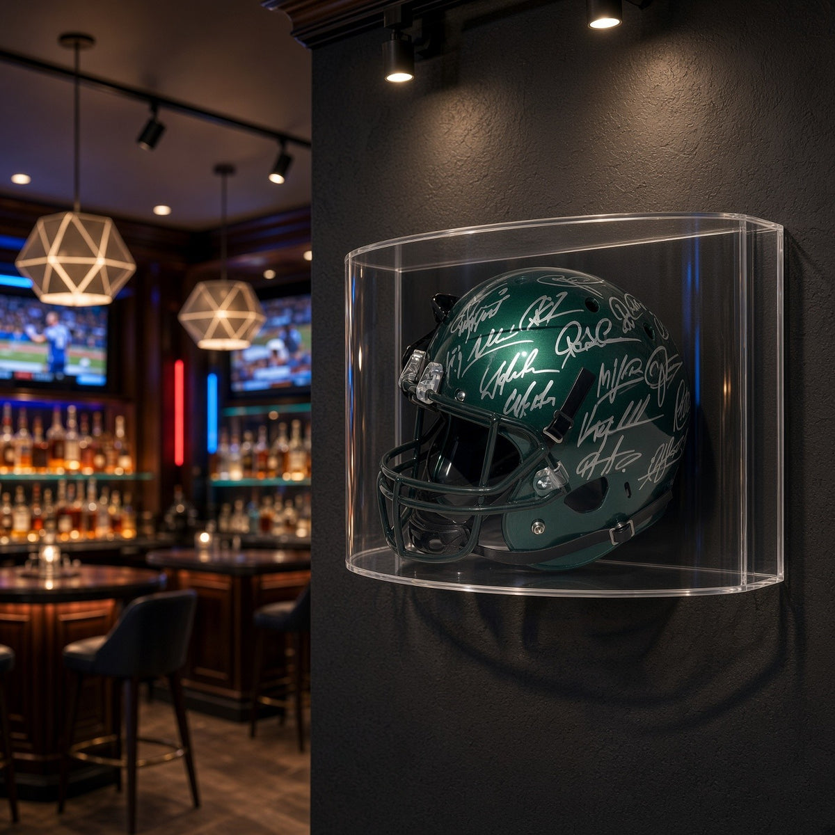 Curved football helmet case mounted on a dark wall in a sports bar