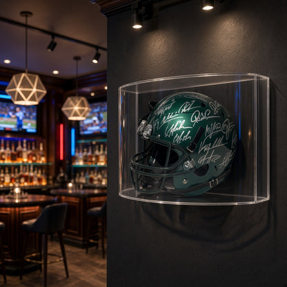 Curved football helmet case mounted on a dark wall in a sports bar