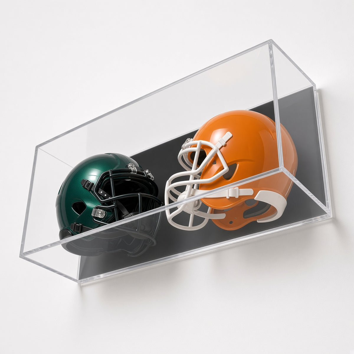 Angled view of two mini helmets in the wall mount case