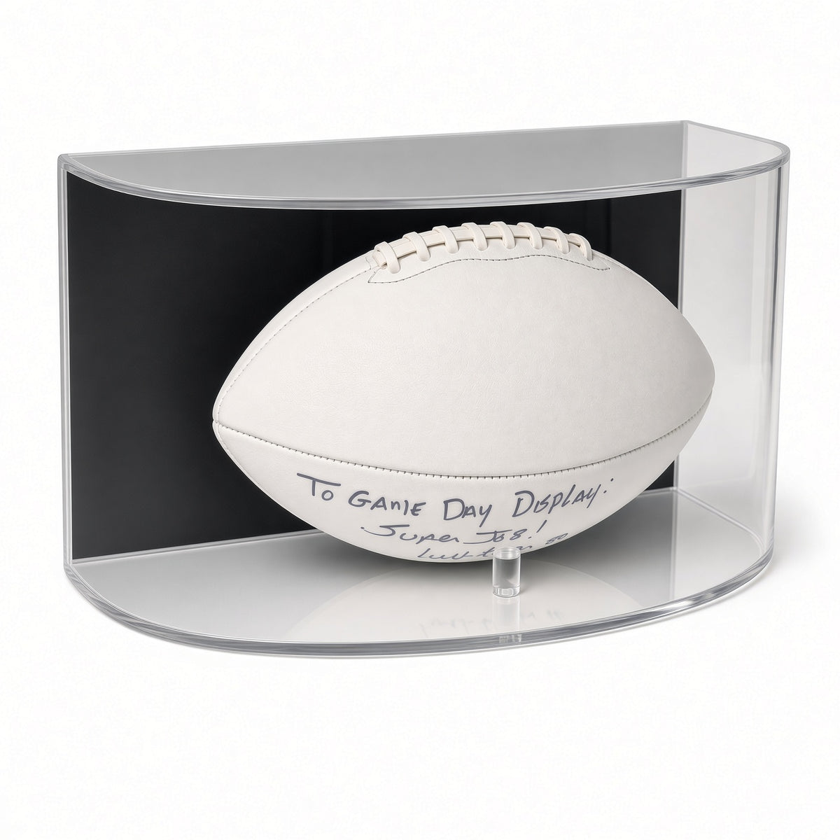 Front view of a white football resting on pegs in the curved case