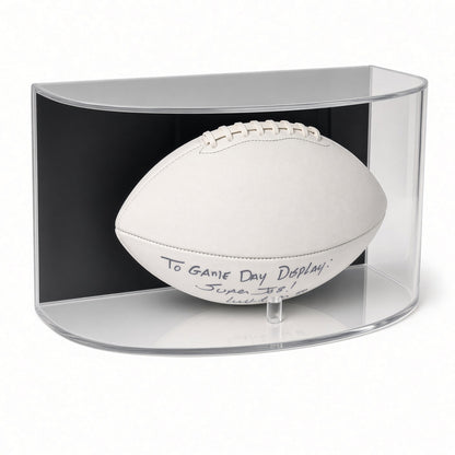 Front view of a white football resting on pegs in the curved case