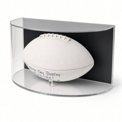 Football displayed in the curved case, shown from a low angle
