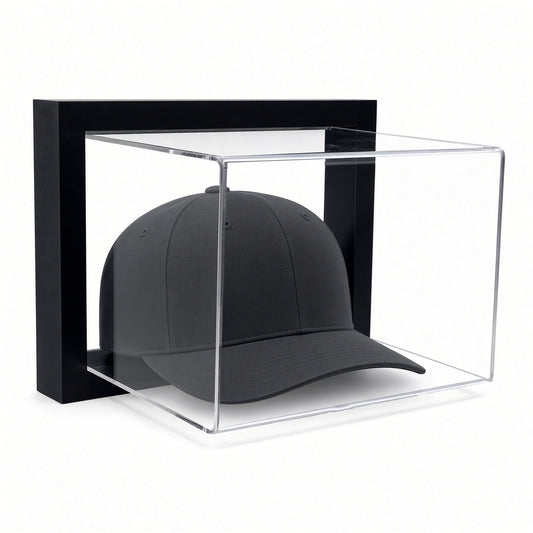Black-framed acrylic wall mount hat display case holding a black baseball cap