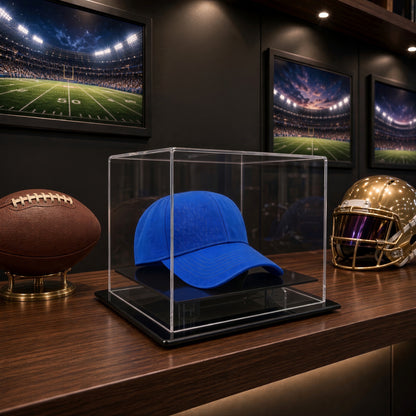 Hat table top case on a counter beside a football in a sports bar