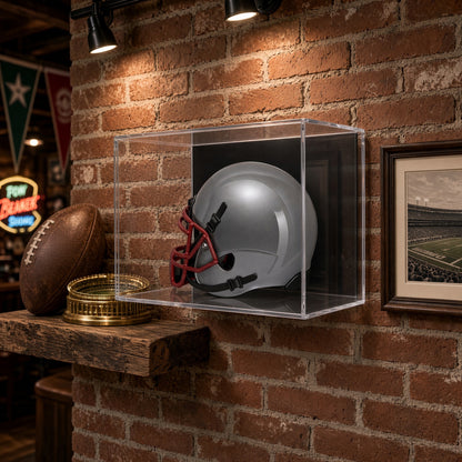 Mini helmet case on a brick wall above a shelf with a football