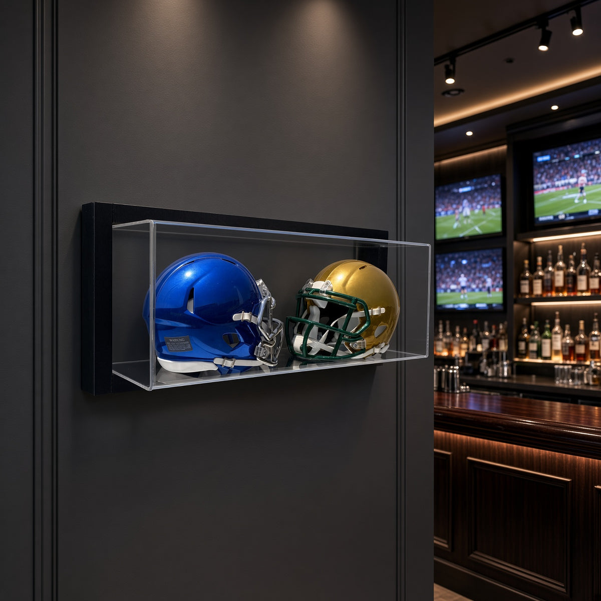 Framed double mini helmet case on a dark wall in a sports bar