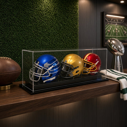 Triple mini helmet case on a counter in front of a green wall