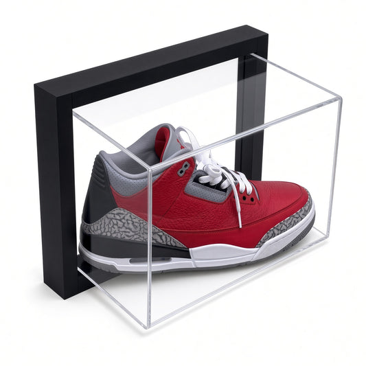 Black-framed acrylic wall mount display case holding a red and gray sneaker