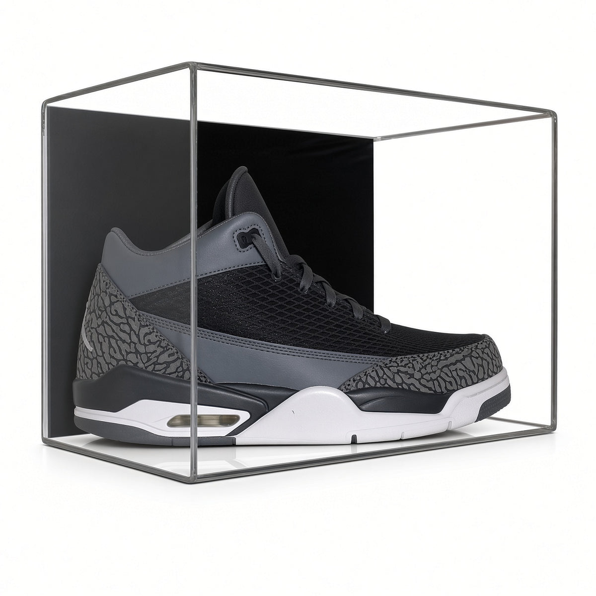 Front view of a gray sneaker inside the wall mount shoe case