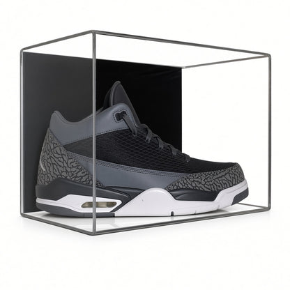 Front view of a gray sneaker inside the wall mount shoe case