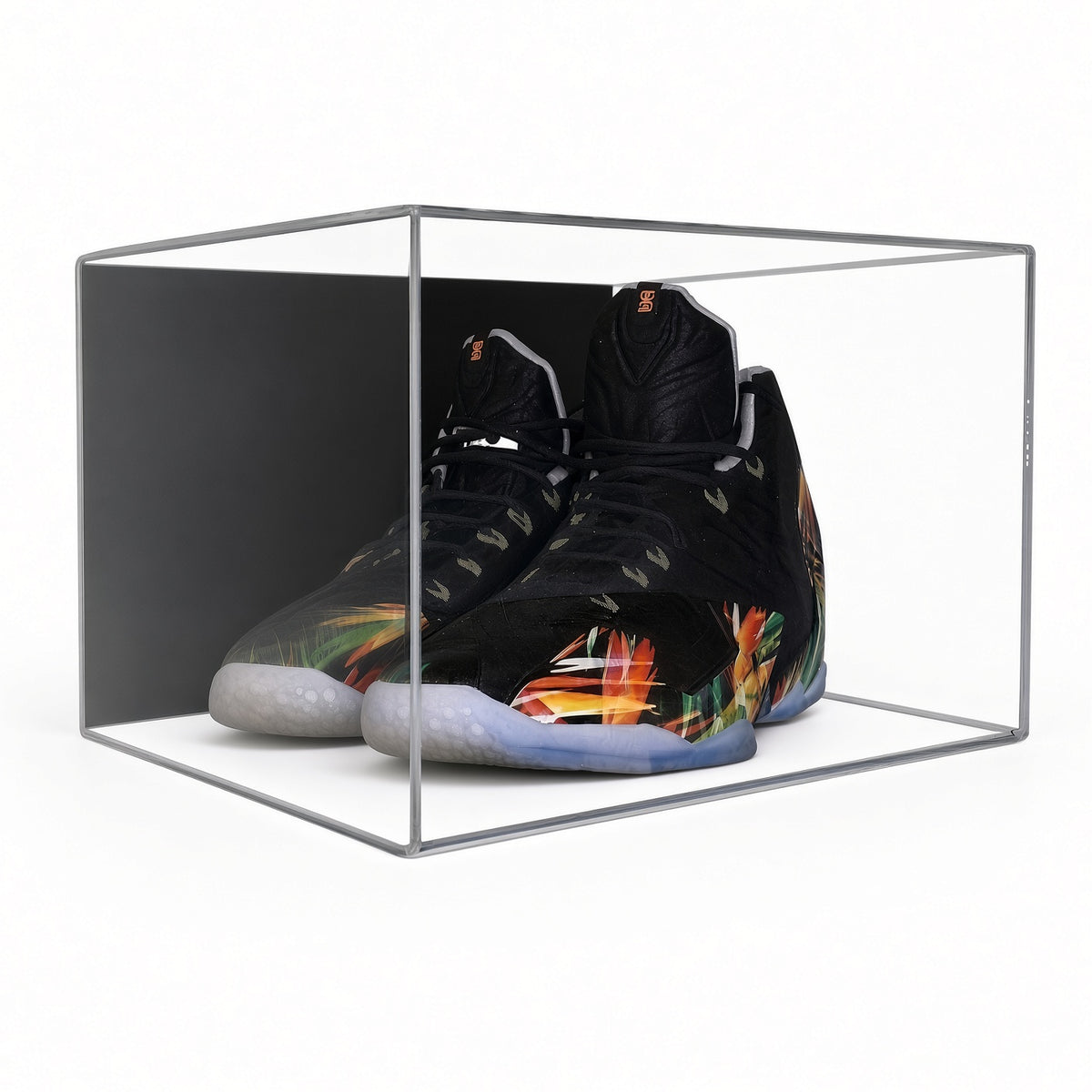 Angled view of the sneakers in the small shoe pair case
