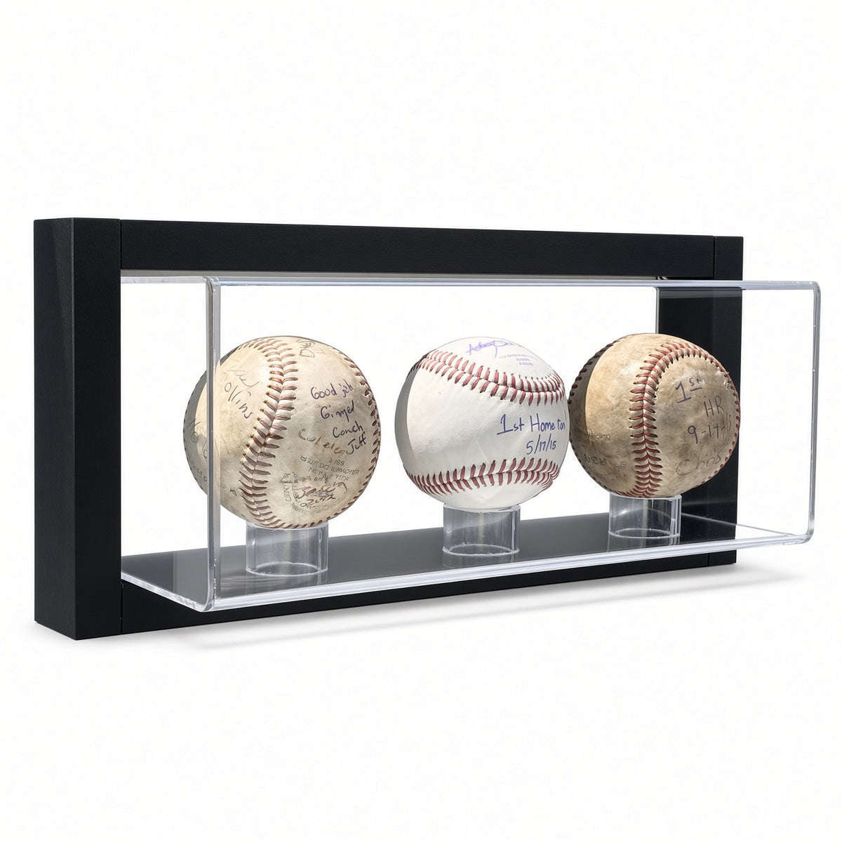 Black-framed acrylic wall mount display case holding three signed baseballs