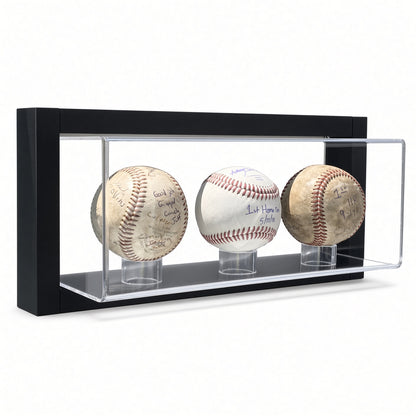Black-framed acrylic wall mount display case holding three signed baseballs