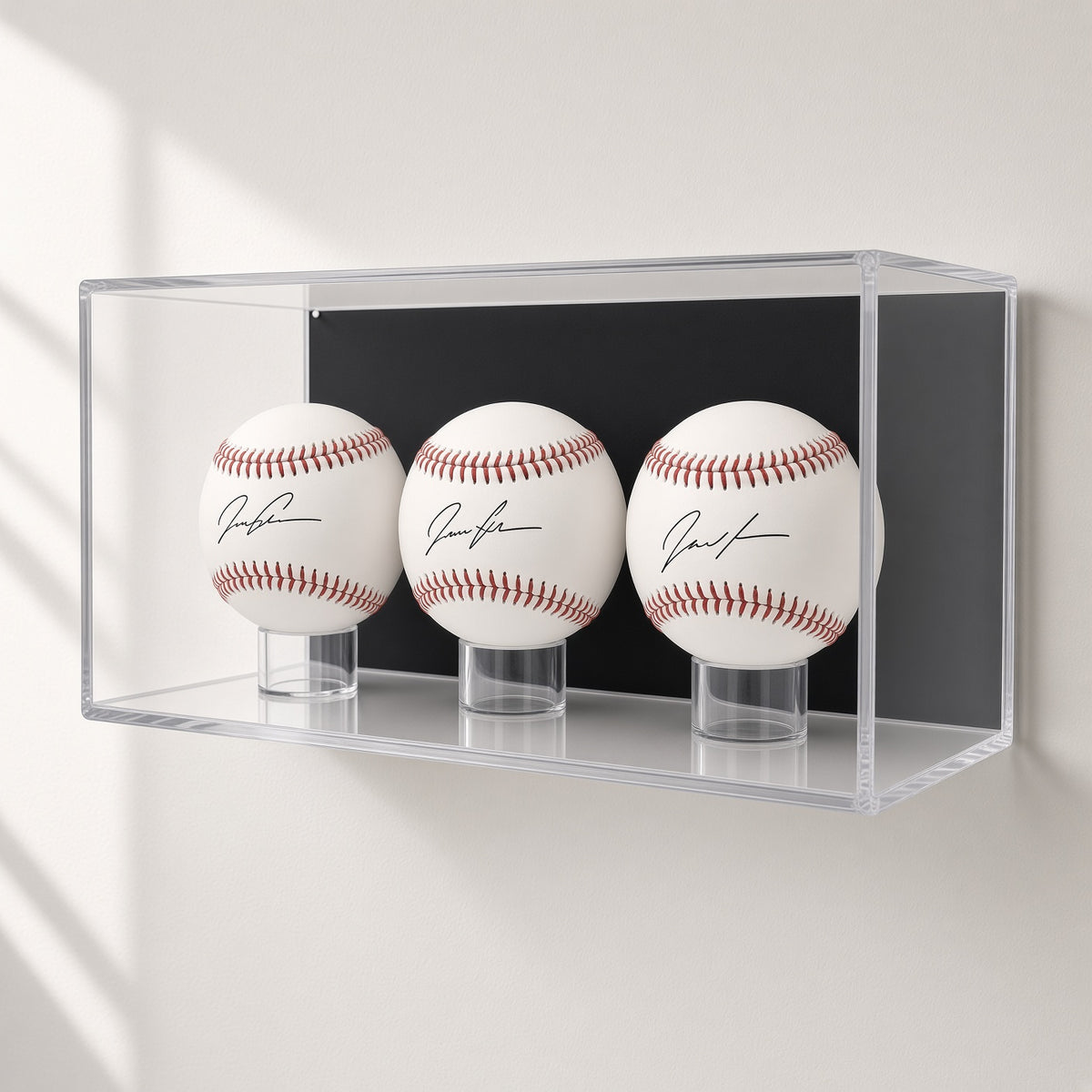 3 baseball case mounted on a plain white wall