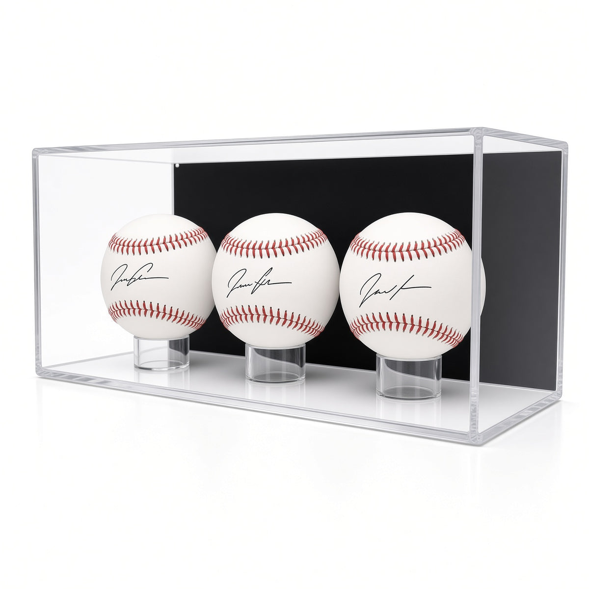 Front view of three signed baseballs on rings in the case