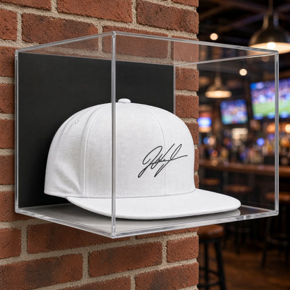 Hat display case on a brick wall in a sports bar
