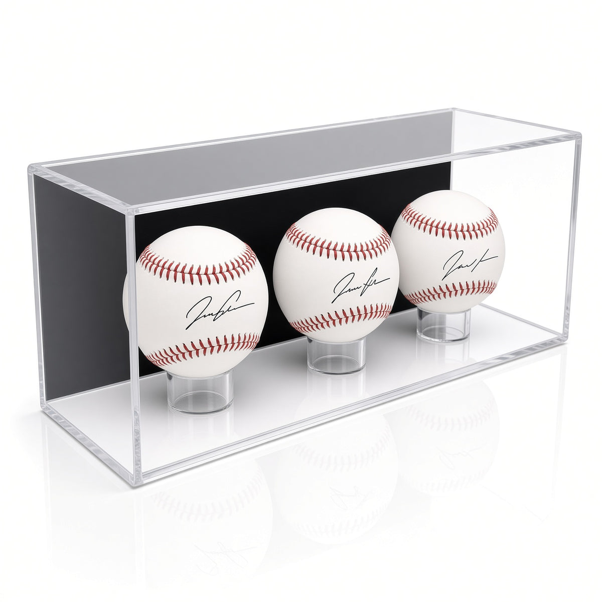 Angled view of three signed baseballs in the wall mount case