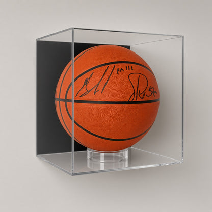 Basketball case with a signed ball mounted on a plain gray wall