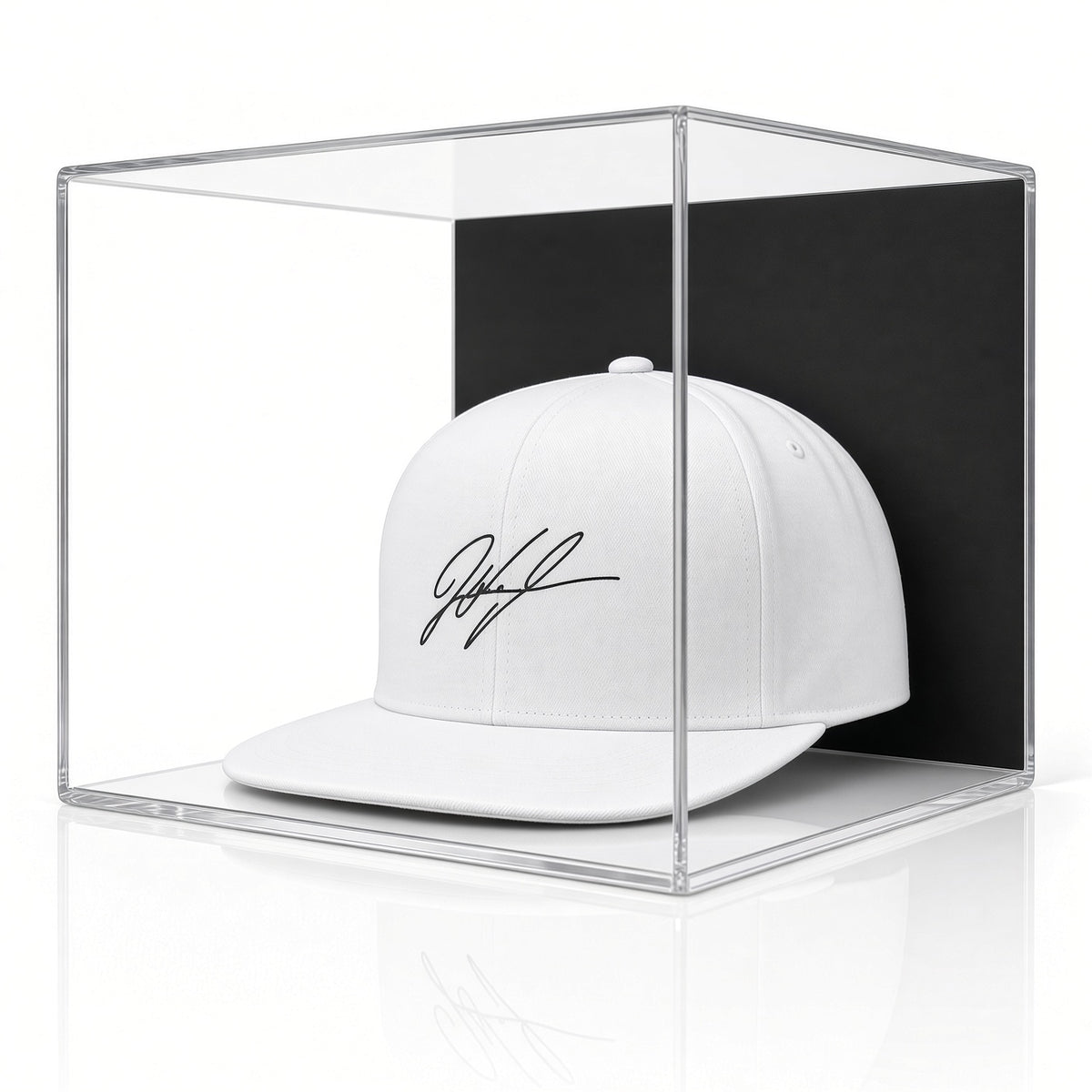 Acrylic wall mount case with a black back holding a signed white baseball cap