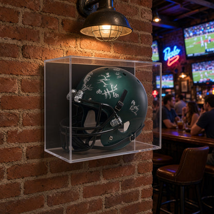 Football helmet display case mounted on a brick wall in a sports bar